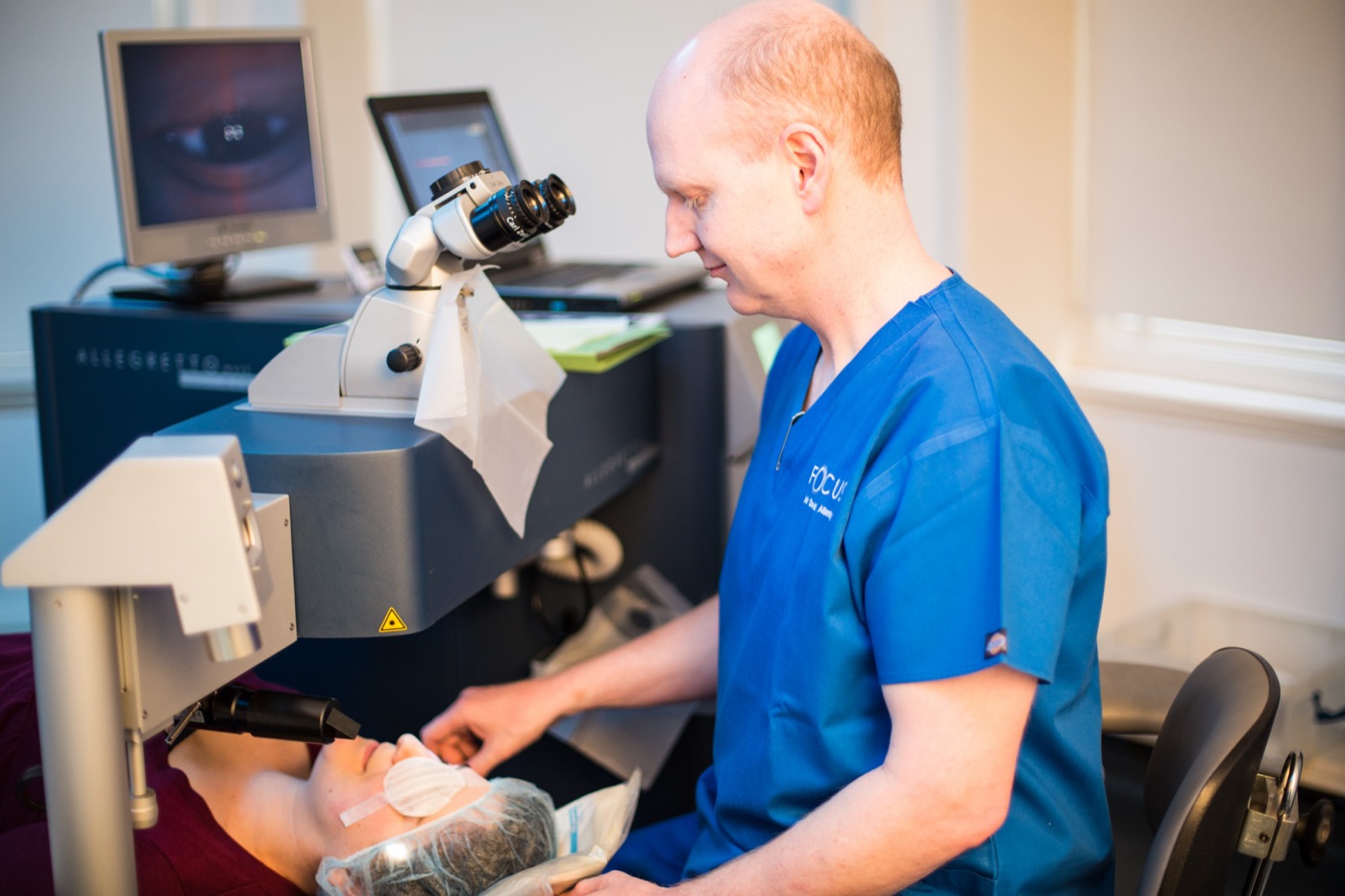 Focus Clinics surgeon reviewing eye scan results
